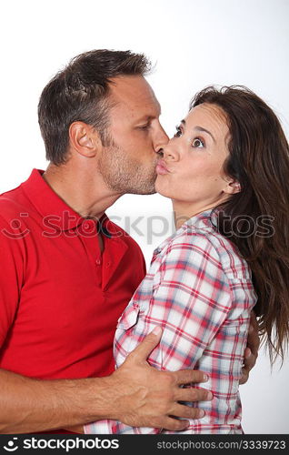 Closeup of in loved couple kissing on white background