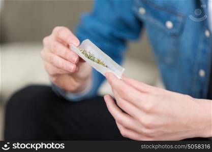 Closeup of joint being rolled