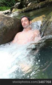 Closeup of man enjoying, river spa water