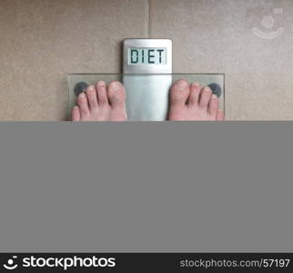 Closeup of man's feet on weight scale - Diet