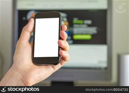 Closeup of Man&rsquo;s Hand holding a Smartphone in Office
