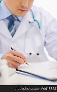 Closeup of medical doctor working with documents