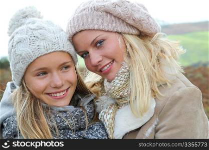 Closeup of mother and daughter in fall