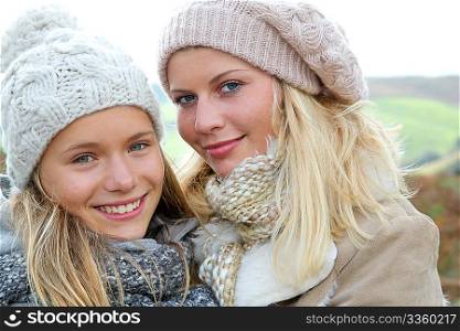 Closeup of mother and daughter in fall