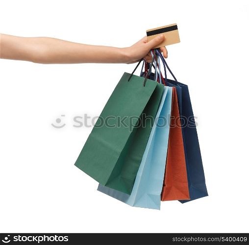 closeup of multi colored shopping bags and credit card.