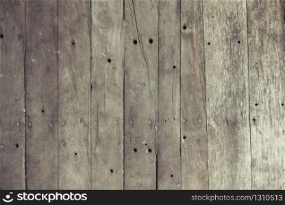 Closeup of old brown wooden plank texture background. Wallpaper backdrop. Abstract wood floor and wall structure. Top view angle. Vertical pattern