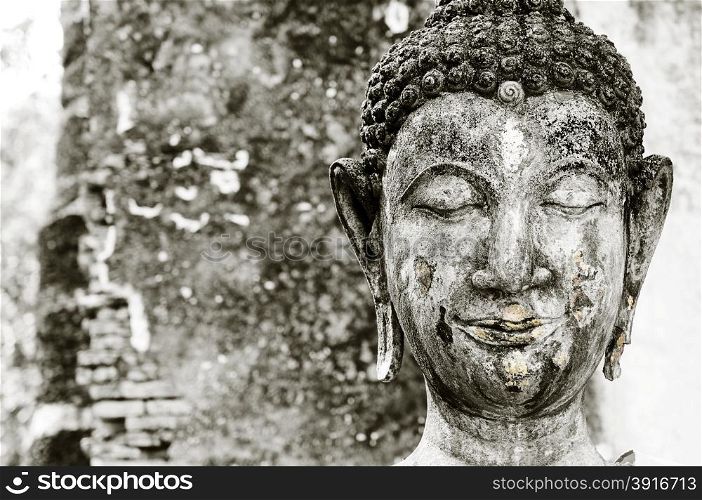 Closeup of old Buddha sculpture.