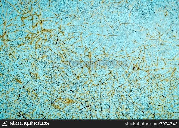 closeup of old, grunge metal car body texture with blue paints and rusty cracks