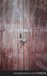 Closeup of old key lock with wood door