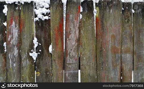 Closeup of old wooden fence in winter&#xA;