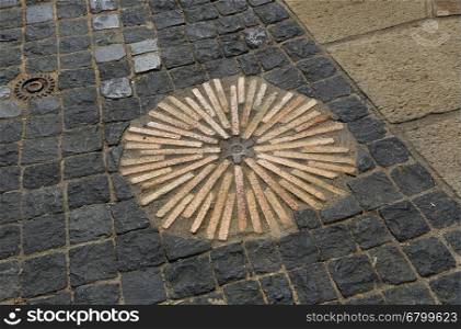 Closeup of pavement with concentric pattern. Patterned floor walkway in the park, Montjuic, Barcelona, Spain.