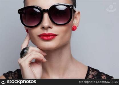 Closeup of perfect model in big rounded sunglasses. text space and copy space