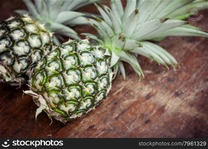 Closeup of pineapple on wooden background