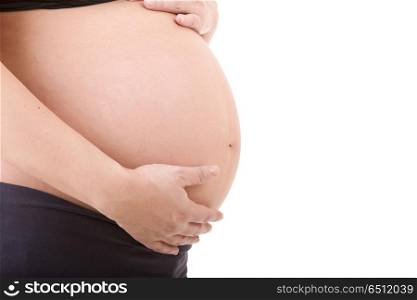Closeup of pregnant woman at white background. pregnant