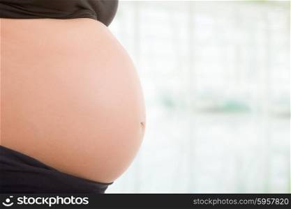 Closeup of pregnant woman belly