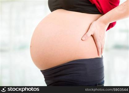 Closeup of pregnant woman, studio picture