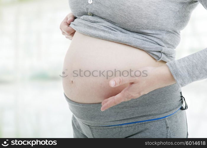 Closeup of pregnant young woman