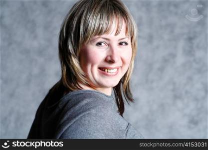 closeup of pretty blond woman in her twenties with great friendly smile
