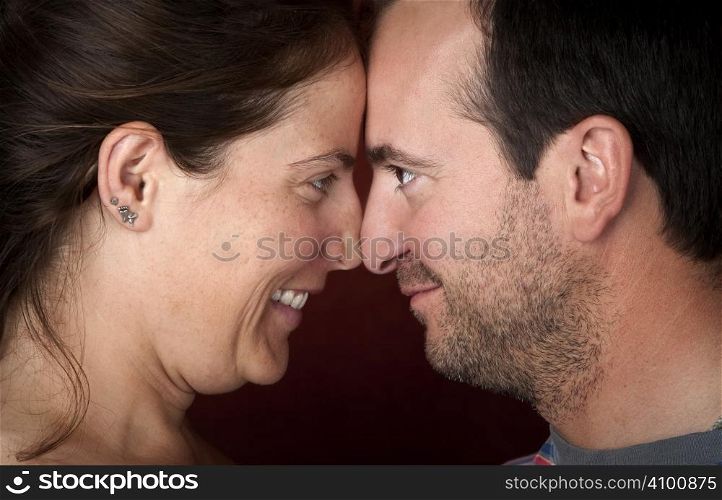 Closeup of pretty woman and handsome man touching noses