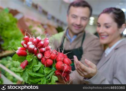 Closeup of radishes in greengrocer store