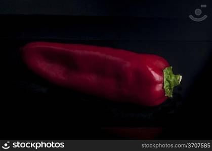 closeup of Red chili peppers on black background