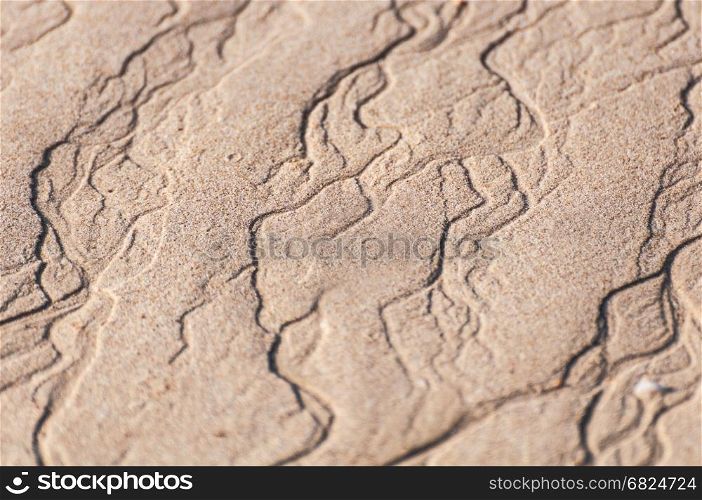 closeup of sand pattern of a beach in the summer thailand
