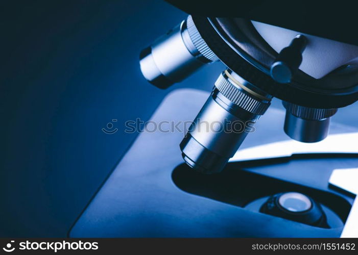 Closeup of Scientific microscope with metal lens in the laboratory, laboratory equipment - optical microscope.