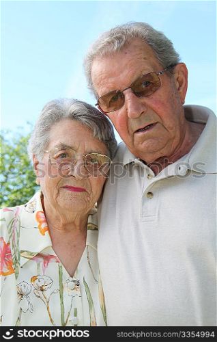 Closeup of senior couple in garden