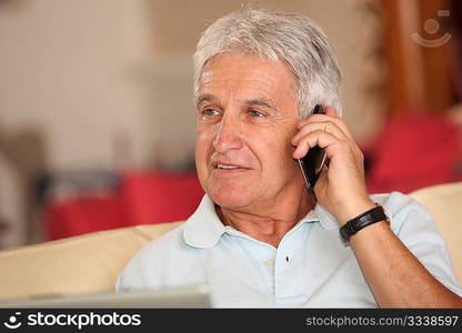 Closeup of senior man talking on mobile phone