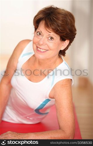 Closeup of senior woman doing stretching exercices