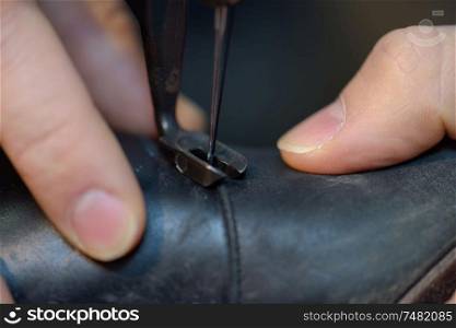 Closeup of shoe being stitched