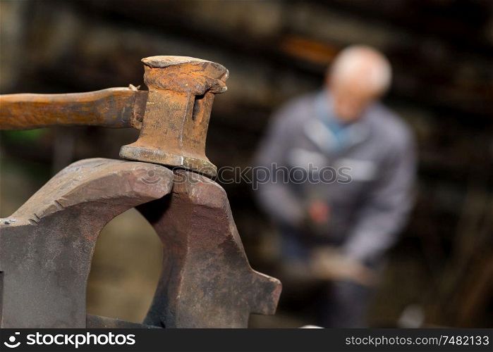 Closeup of sledgehammer in blacksmith's workshop