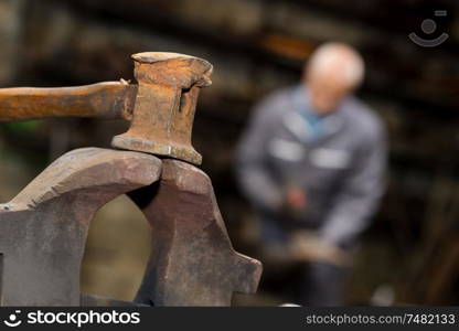 Closeup of sledgehammer in blacksmith's workshop