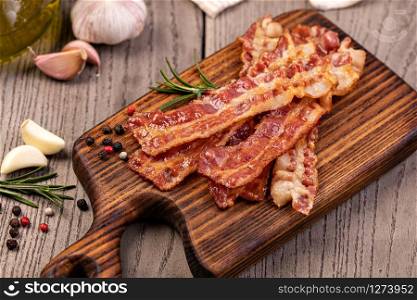 Closeup of slices of crispy hot fried bacon. fried bacon