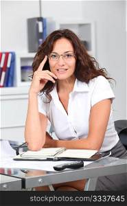 Closeup of smiling businesswoman wearing eyeglasses
