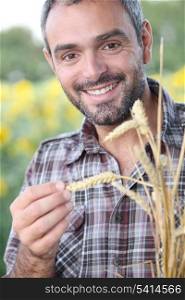 Closeup of smiling man in a cornfield