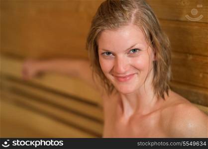 Closeup of smiling sweaty woman in sauna