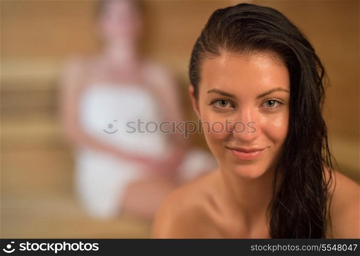 Closeup of smiling sweaty woman in the sauna