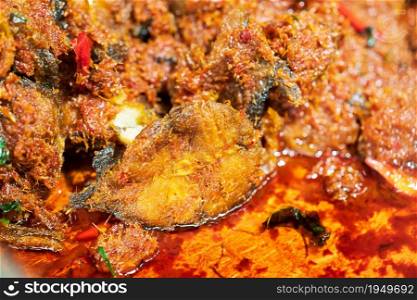 Closeup of Stir Fried Crispy Catfish with Curry background thai street food market