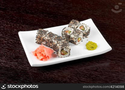 Closeup of Sushi rolls at plate with sesame