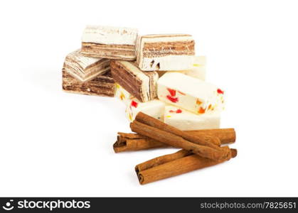 Closeup of sweets and cinnamon over white