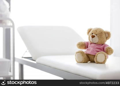 Closeup of teddybear on bed at hospital