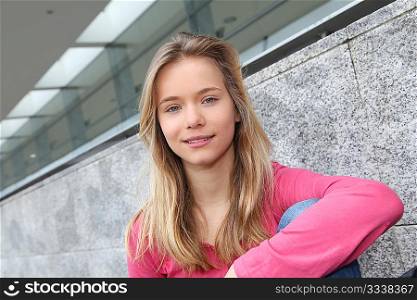 Closeup of teenage girl sitting on a school bench