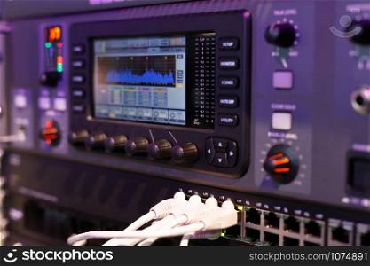 Closeup of the compact digital mixing console. Selective focus.