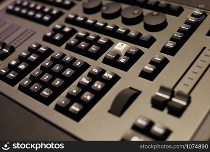 Closeup of the front panel of lighting control console. Selective focus.