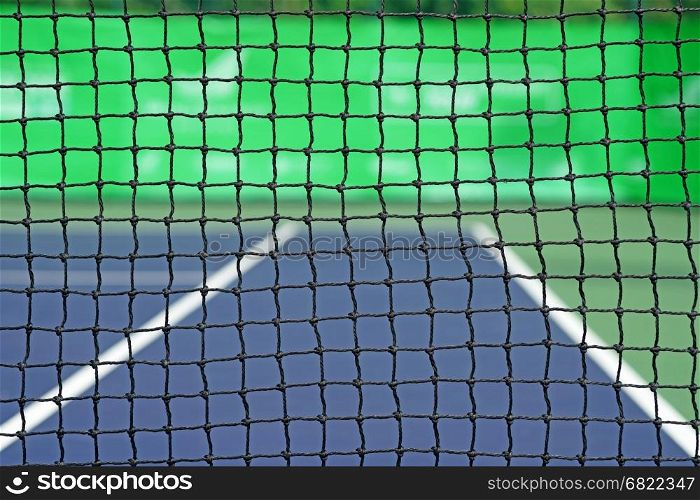 closeup of the net in tennis court