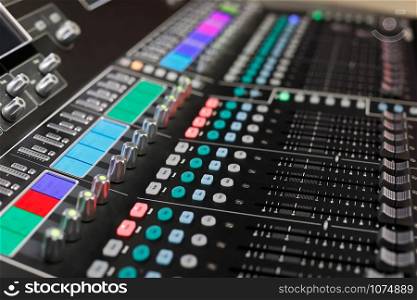 Closeup of the professional audio mixing console. Selective focus.