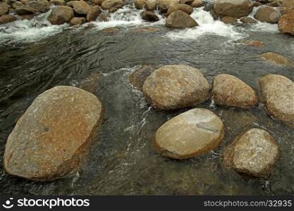 closeup of the stone and water in mountain stream