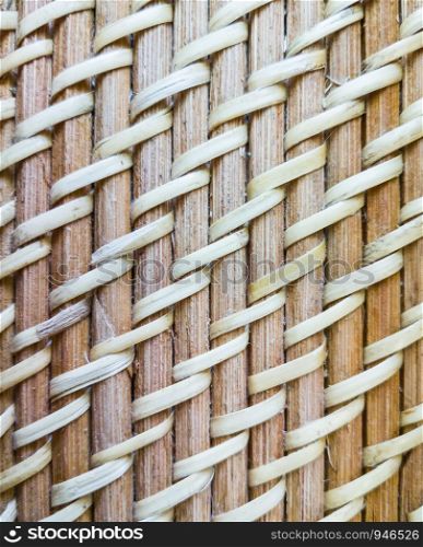 Closeup of the woven pattern with the cobweb on the old basket.