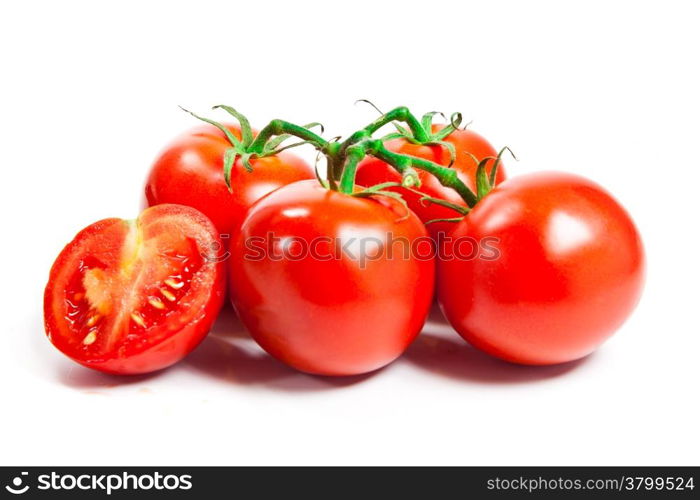 Closeup of tomatoes on the vine isolated on white